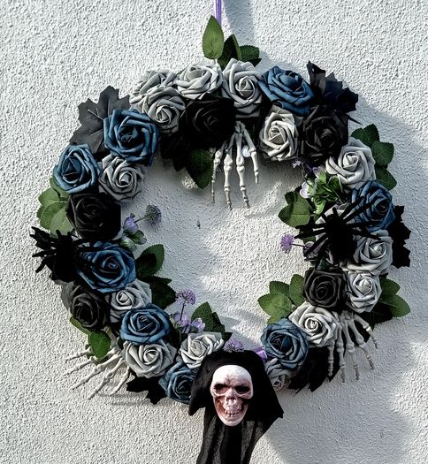 Halloween wreath with roses, skeletons and spiders