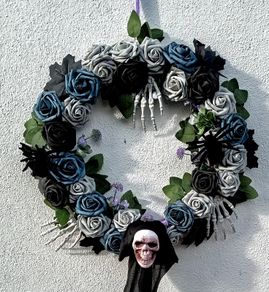 Halloween wreath with roses, skeletons and spiders