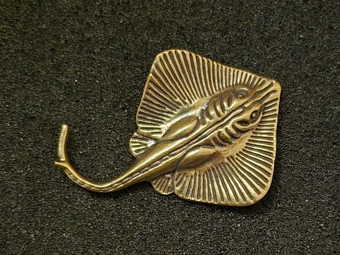 3 brass fish.