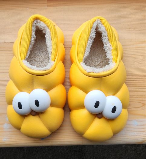 Child's plush lined yellow funny eyes slippers