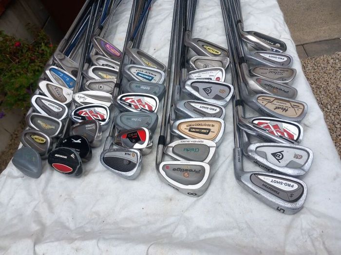 A selection of golf clubs and bags. NOT SELLING SEPARATE