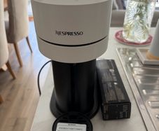 nespresso coffee machine with pack of capsules