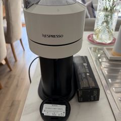 nespresso coffee machine with pack of capsules