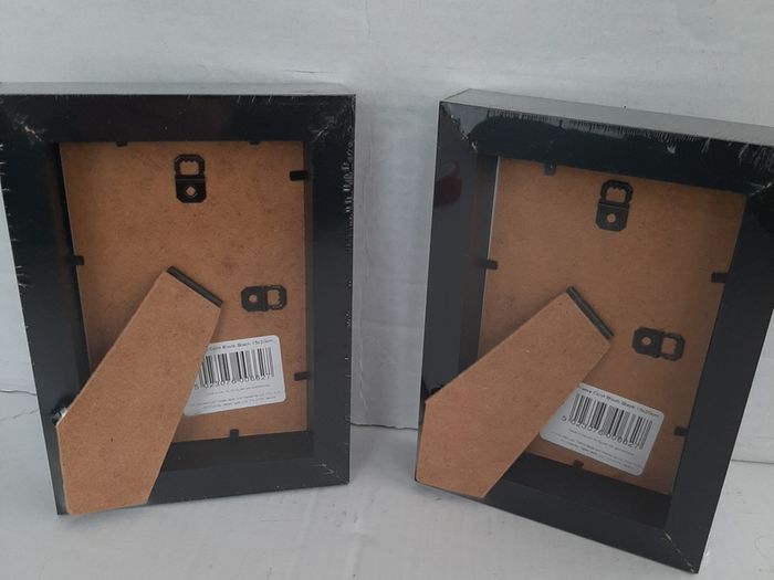 2 new wooden photo frames in wrapping
