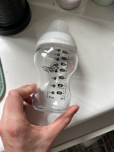 2 glass baby bottles