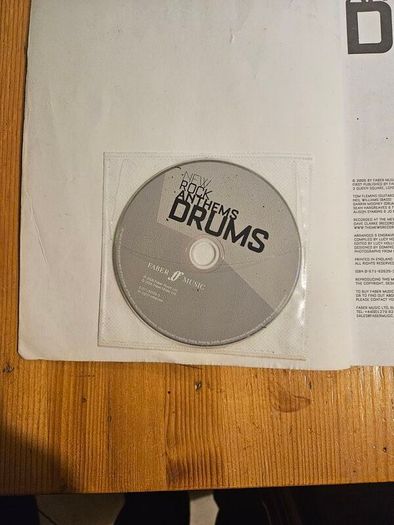 New Rock Anthems Drums. Complete With Cd. Large Volume Paperback In Good Condition.  See Photos For Same.