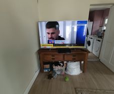 Philip's 65 inch TV working perfectly and solid oak dresser 59 inches wide