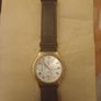 This is a gold-tone Seiko Vintage V657-8110 quartz chronograph watch featuring a cream dial with Roman numerals and three sub-dials Image 2