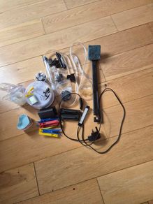 Misc aquarium accessories and three small heart shaped pet bowls