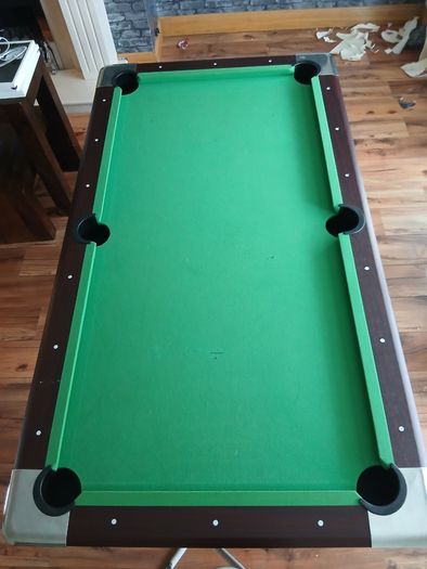 Pool table with cues and balls