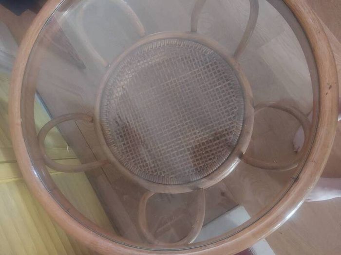 Round wicker coffee table with glass