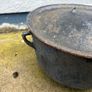 Antique cast iron tri-legged dutch oven and lid. Image 4