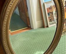 Oval Gilt-Framed Mirror