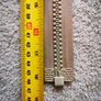 Zip, beige, separates /splits to be sewn into the jacket Image 4