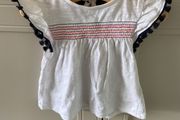 2 piece baby outfit navy leggings white top with neon orange thread detail &amp; navy fringing on capped sleeves