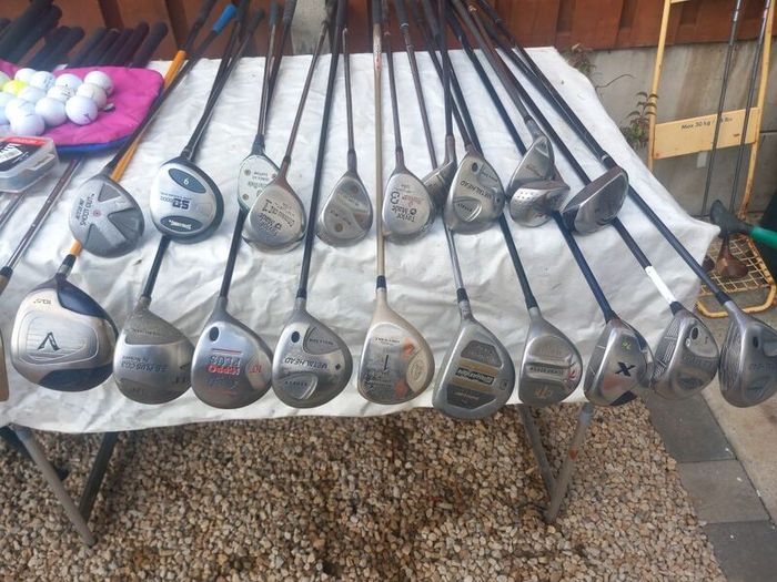 A selection of golf clubs and bags. Golf balls
