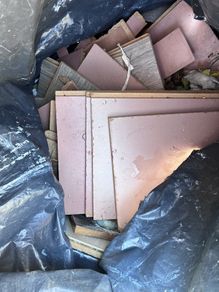 Black bin bag if off cuts if laminate floors