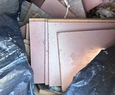 Black bin bag if off cuts if laminate floors