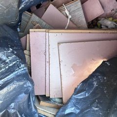 Black bin bag if off cuts if laminate floors