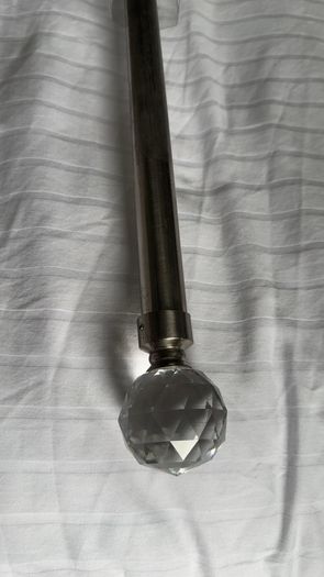 Curtain pole for eyelet curtains