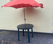 Garden table and parasol