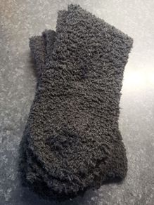 Two. Pairs of. Black fluffy socks