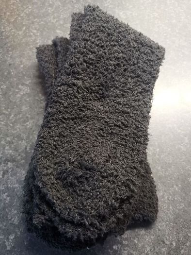 Two. Pairs of. Black fluffy socks