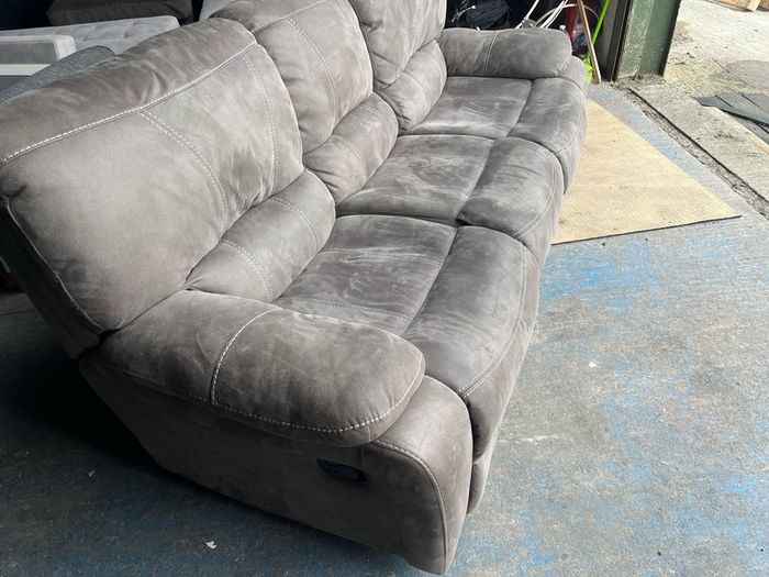 Grey 3 seater recliner sofa.