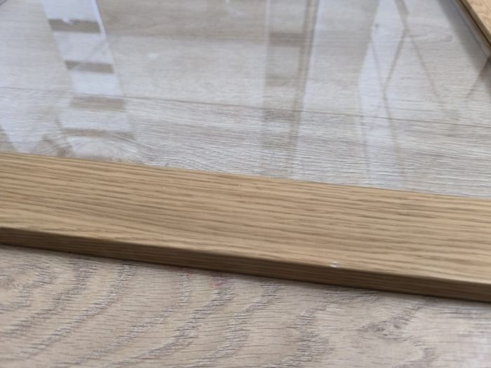 Original IKEA BESTA cabinet door/front panel in discontinued natural oak finish with clear glass centre.