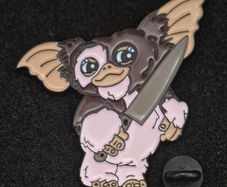 Gremlin , pin back badge.