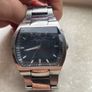 Kenneth Cole designer watch. Water Resistant. A few worn scratches but still working perfectly. Battery easily replaced and sits into the back of it. Image 5