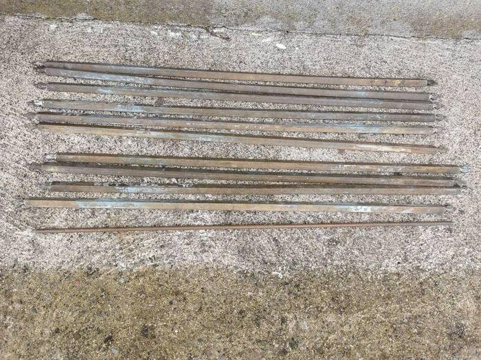 A set of old brass staire rods