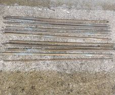 A set of old brass staire rods