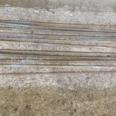 A set of old brass staire rods