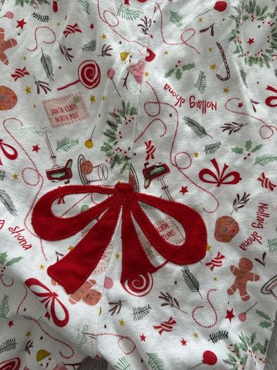 Christmas onesie with a cute bow at the back, 3-4 years (will fit a bigger child)