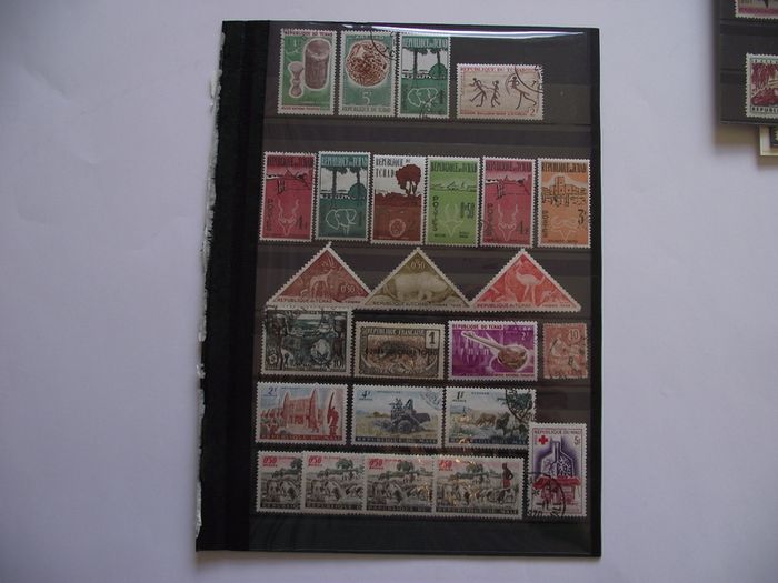 The collection of old stamps from French colonies on stock cards