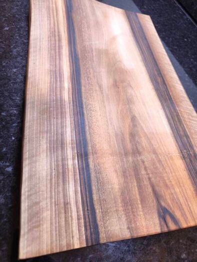One piece of solid European Walnut, no glue, no joints. Hand-sanded and oiled with food-safe oi