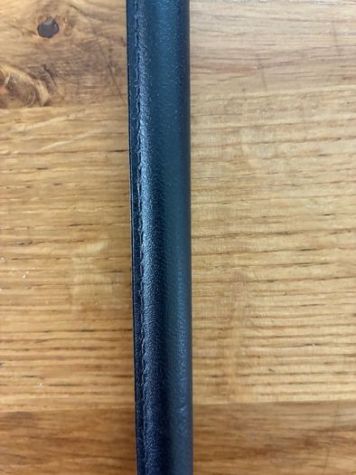 Brand new black leather showing cane