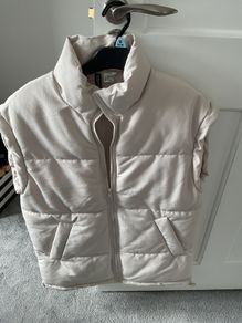 Cream sleeveless jacket
