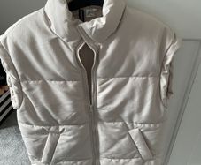 Cream sleeveless jacket