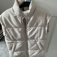 Cream sleeveless jacket