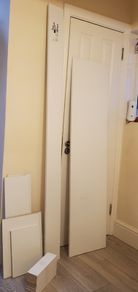 White furniture panels, wooden bits