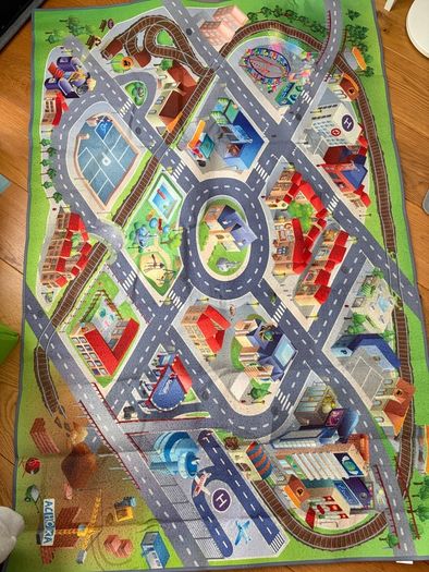three toy cars playing mats