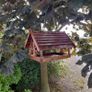 Bird feeders and basket stands . Image 8