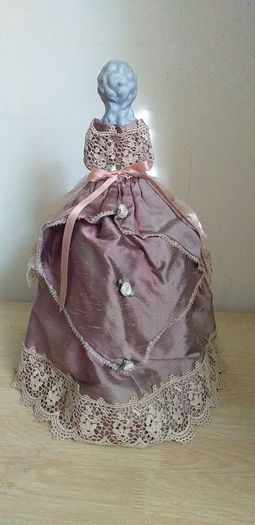 antique half pin doll with skirt