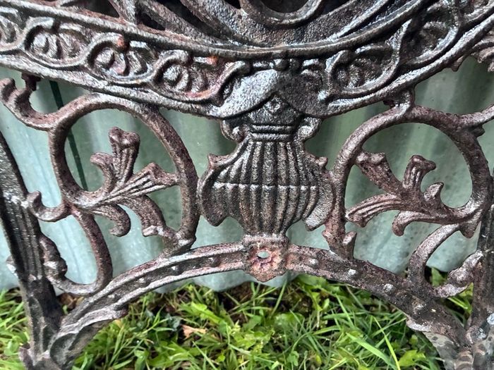 Pair of decorative cast iron bench ends