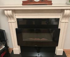 marble fireplace and electric fire