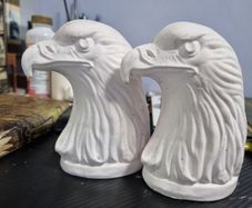 Pair of plaster eagle ornaments