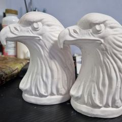 Pair of plaster eagle ornaments