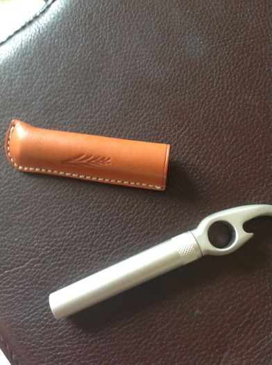 Corkscrew/ Bottle opener in Leather case.
